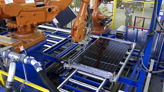 Robotic production of a solar panel. Copyright by GREENoneTEC.