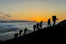 Hikers at sunset